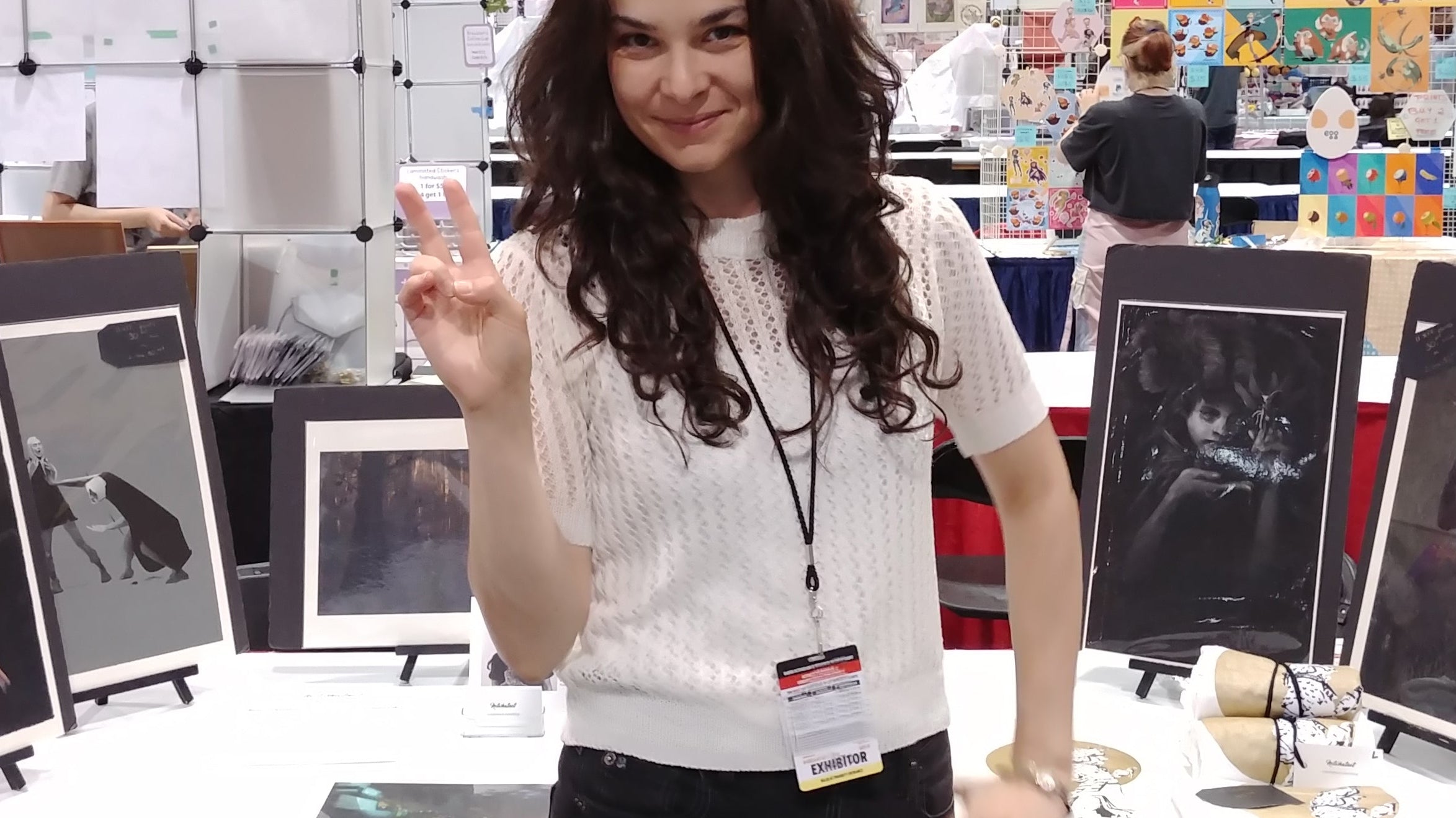 Notwhatnot standing in front of her booth at an art show